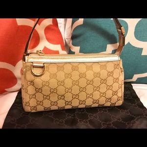 Authentic Gucci metallic gold abbey pochette